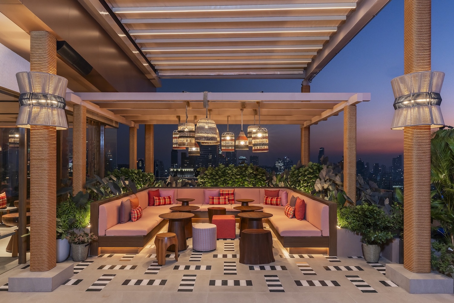 VIP area with Bangkok skyline views at Sato San Rooftop Bar
